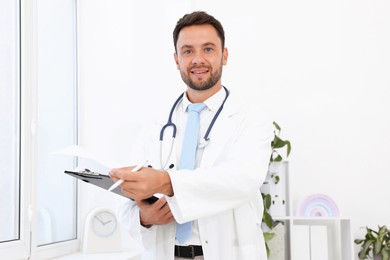 Photo of Pediatrician with stethoscope and clipboard in hospital