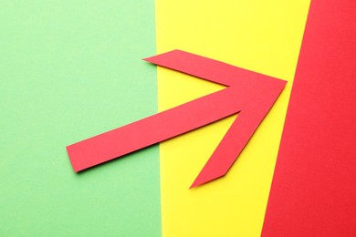 Photo of Risk. Red arrow on color background, flat lay