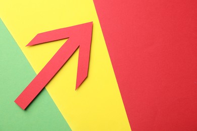 Photo of Risk. Red arrow on color background, flat lay. Space for text