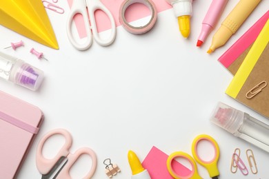 Photo of Frame of glue and other stationery on white background, flat lay. Space for text