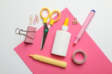 Photo of Glue and other stationery on white background, flat lay