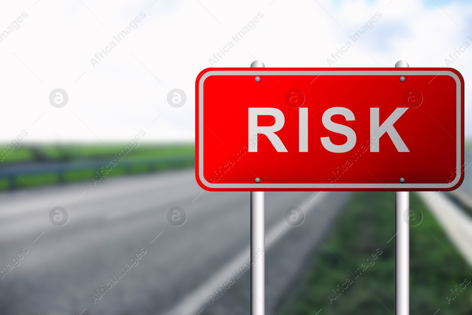 Image of Red road sign with word Risk outdoors