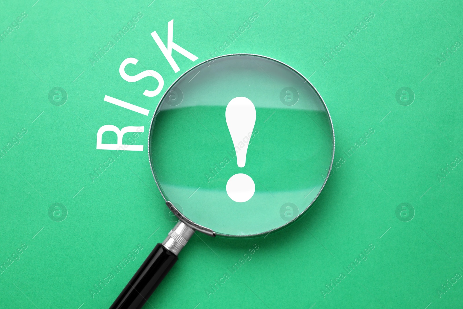 Image of Word Risk and magnifying glass above exclamation sign on green background, top view