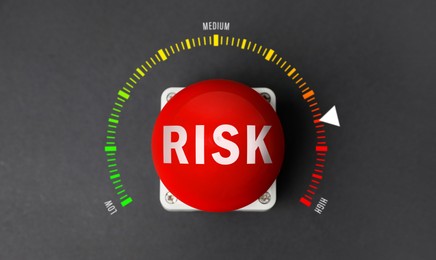 Image of Red button with word Risk and scale from low to high on grey background, top view