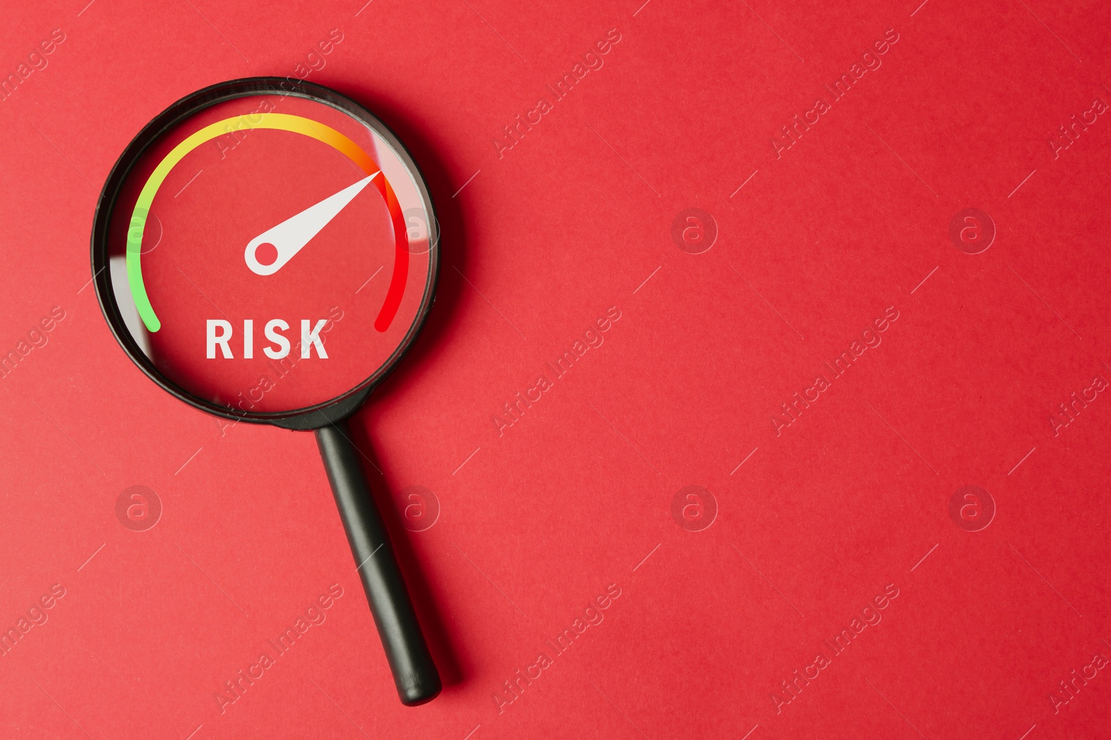 Magnifying glass with word Risk and scale inside on red background, top view Image of Magnifying glass with word Risk and scale inside on red background, top view