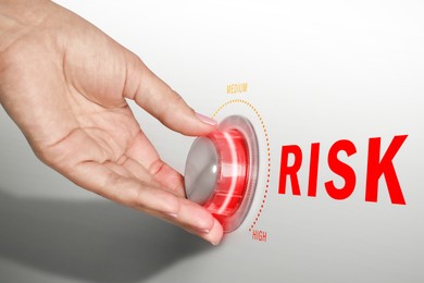 Image of Woman regulating level of risk using knob, closeup