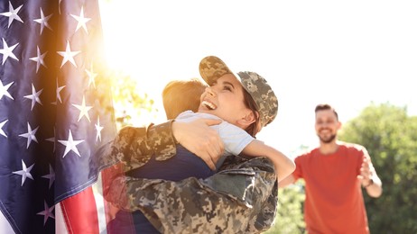 Image of Military woman and her family outdoors, double exposure with national flag of USA. Banner design