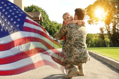Image of Military man and his daughter outdoors, double exposure with national flag of USA