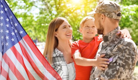Image of Military man and his family outdoors, double exposure with national flag of USA. Banner design