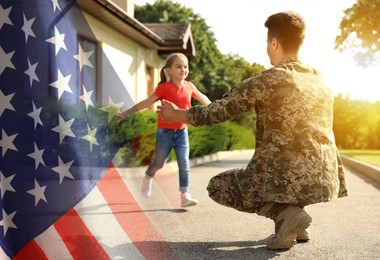Image of Military man and his daughter outdoors, double exposure with national flag of USA