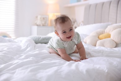 Photo of Cute little baby on bed at home