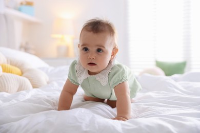 Photo of Cute little baby on bed at home