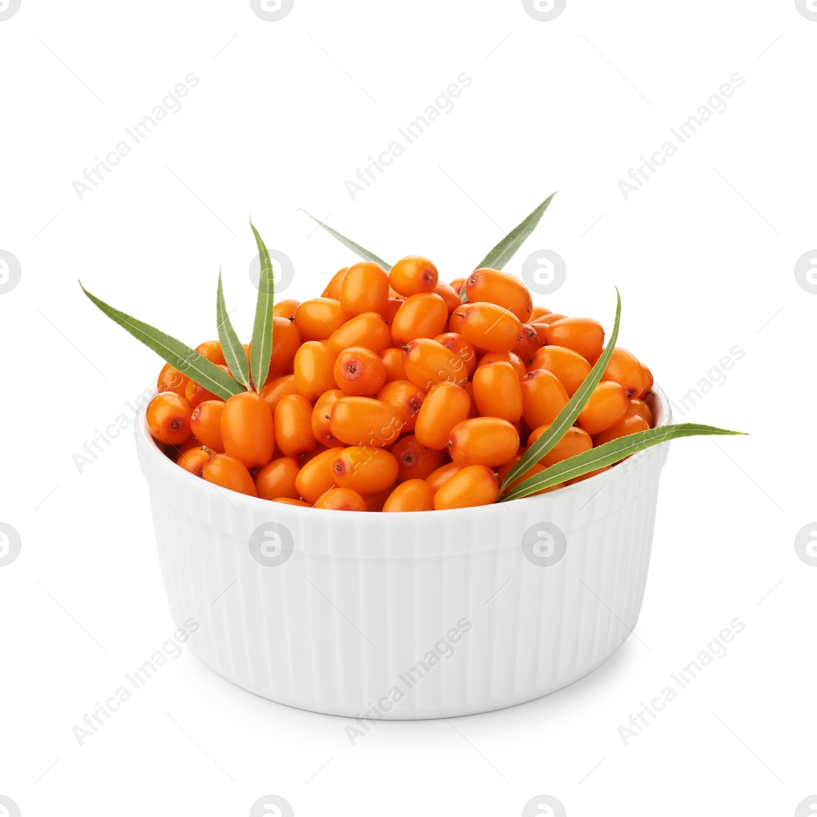 Photo of Fresh sea buckthorn berries with green leaves in bowl isolated on white