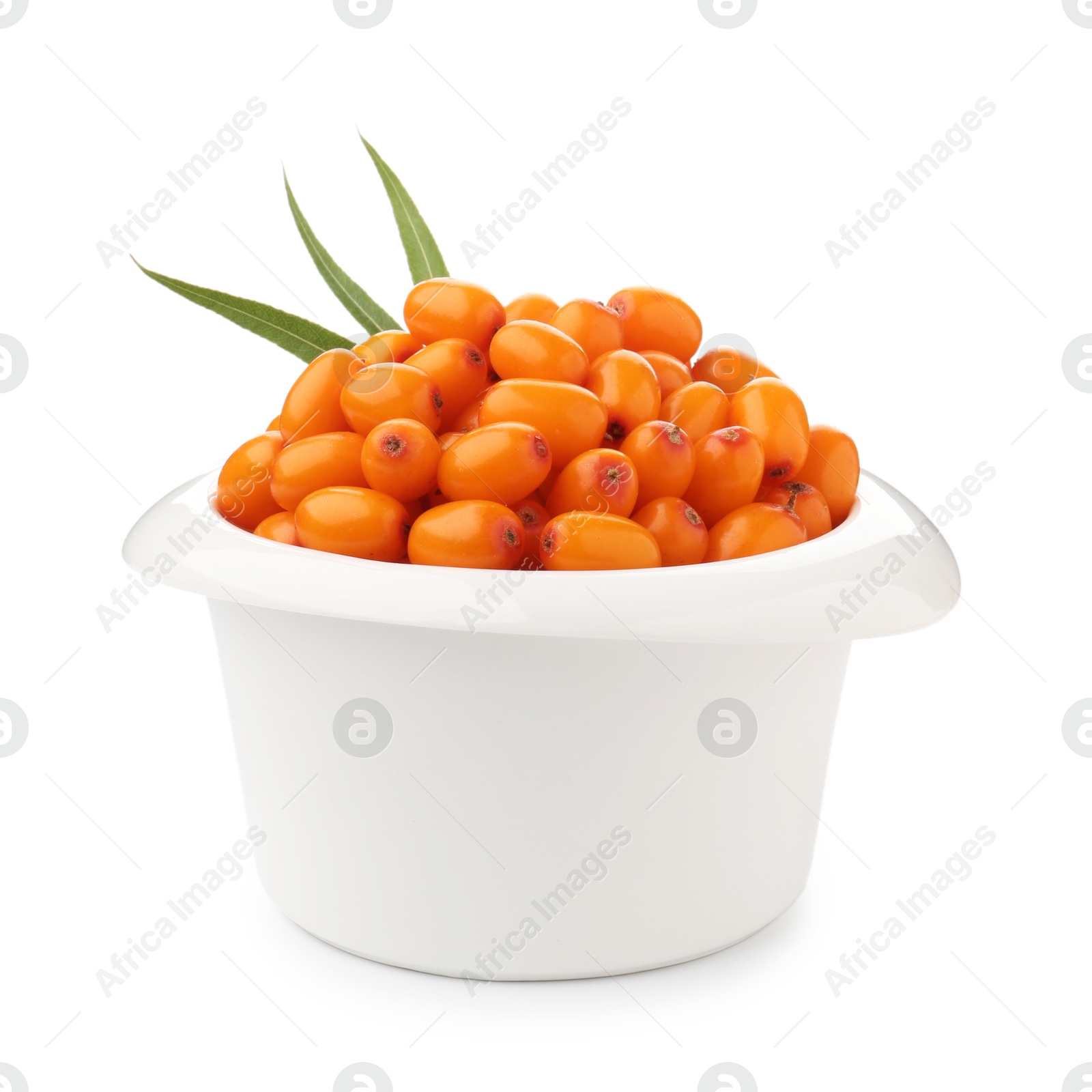 Photo of Fresh sea buckthorn berries with green leaves isolated on white