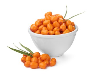 Photo of Fresh sea buckthorn berries with green leaves isolated on white