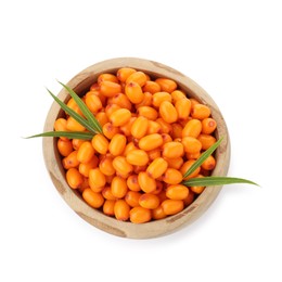 Photo of Fresh sea buckthorn berries with green leaves in bowl isolated on white, top view