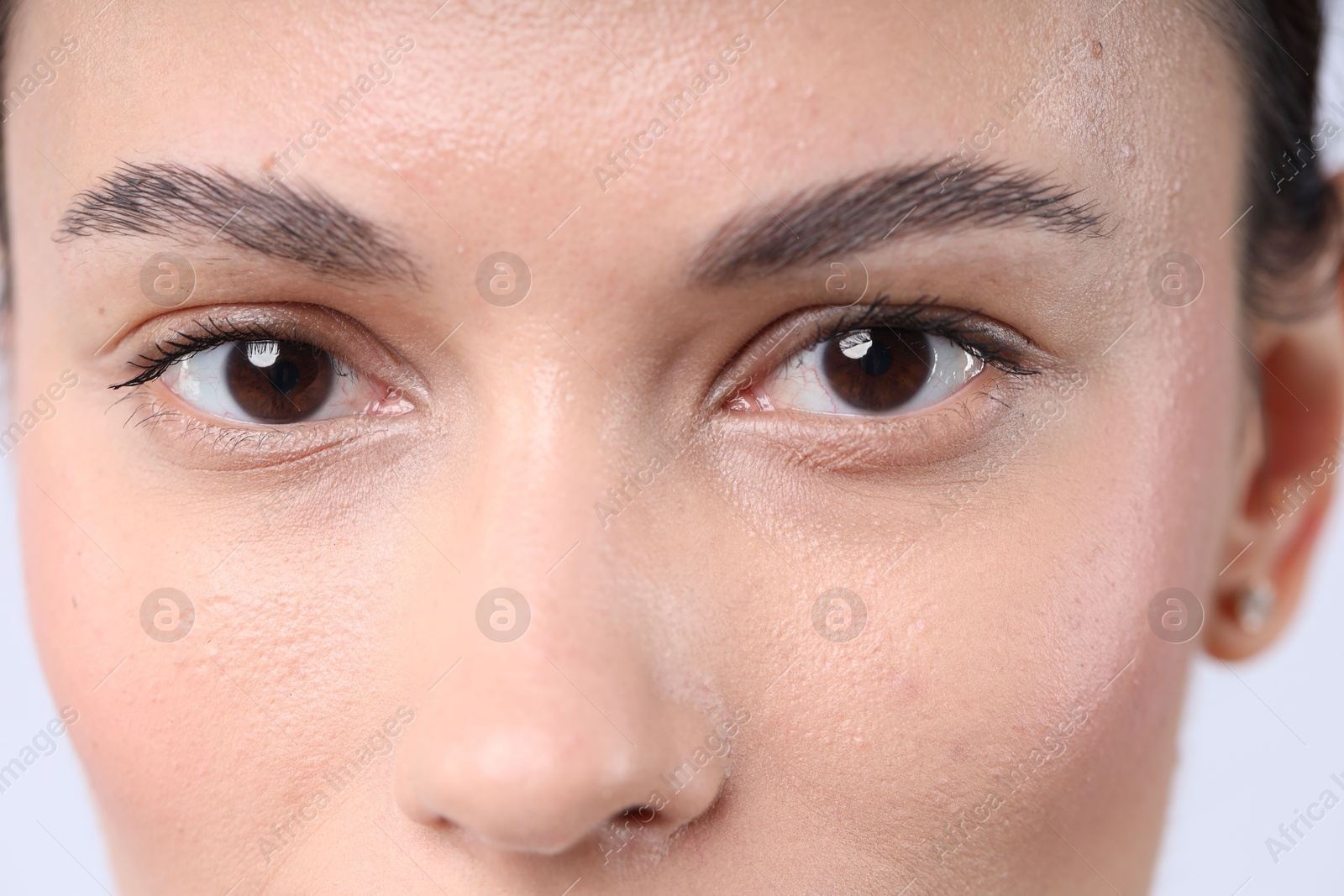 Photo of Woman with normal skin on light background, closeup