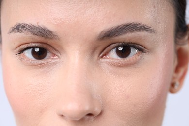 Photo of Woman with normal skin on light background, closeup