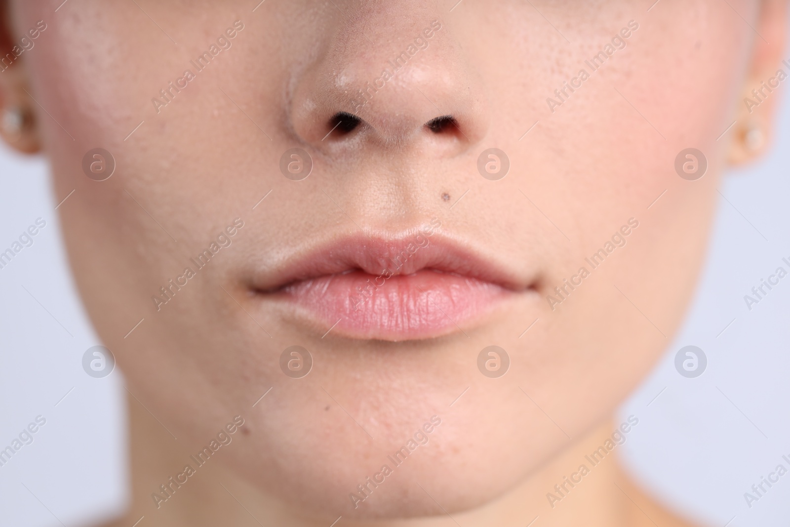 Photo of Woman with normal skin on light background, closeup