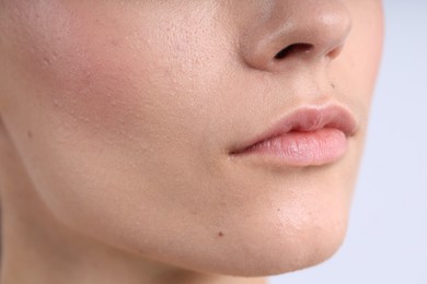Photo of Woman with normal skin on light background, closeup