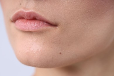 Photo of Woman with normal skin on light background, closeup