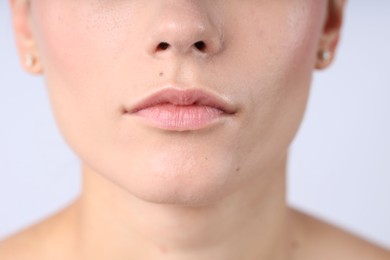 Photo of Woman with normal skin on light background, closeup