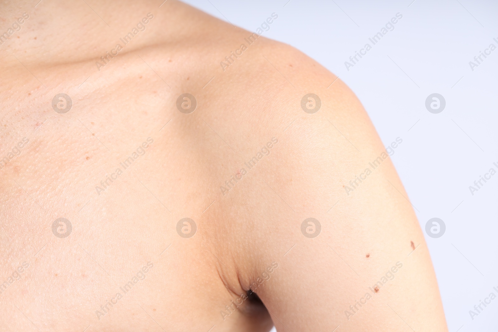 Photo of Woman with normal skin on light background, closeup