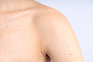 Photo of Woman with normal skin on light background, closeup