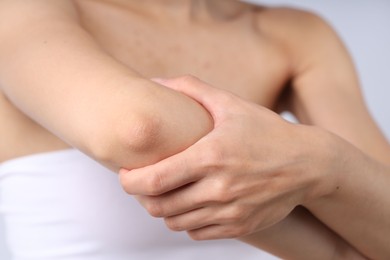 Photo of Woman with normal skin on light background, closeup