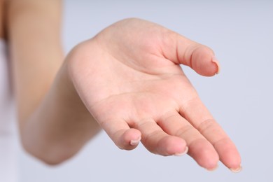 Photo of Woman with normal skin on light background, closeup