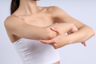 Photo of Woman with normal skin on light background, closeup