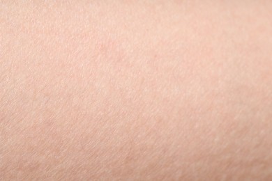 Photo of Texture of normal skin as background, closeup