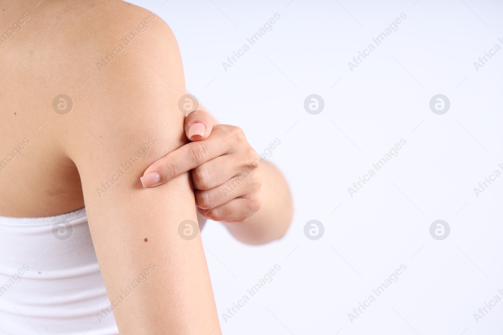 Photo of Woman with normal skin on light background, closeup. Space for text
