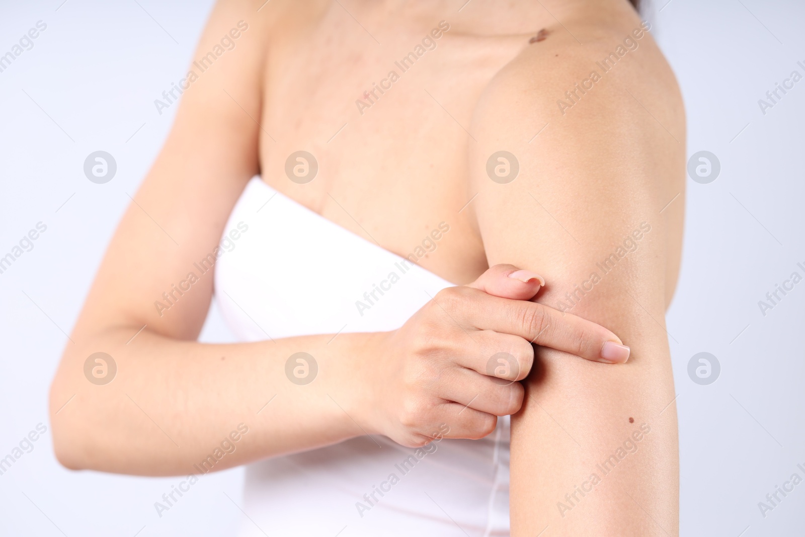 Photo of Woman with normal skin on light background, closeup
