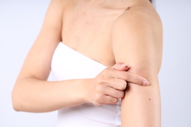 Photo of Woman with normal skin on light background, closeup