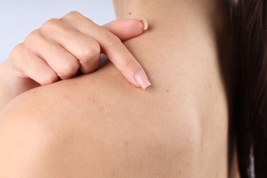 Photo of Woman with normal skin on light background, closeup