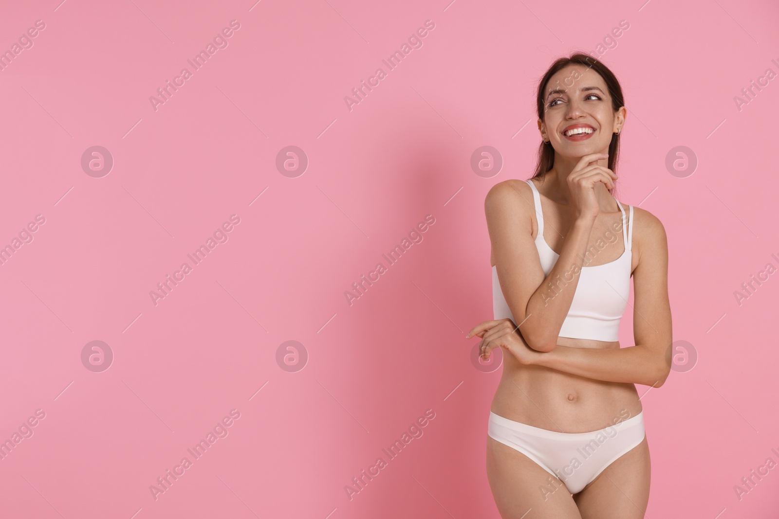 Photo of Woman with slim body on pink background, space for text