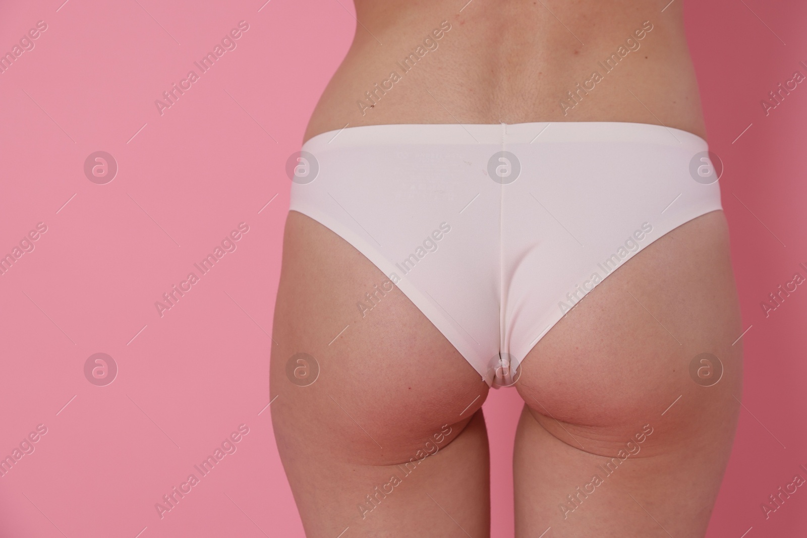 Photo of Woman with slim body on pink background, closeup. Space for text