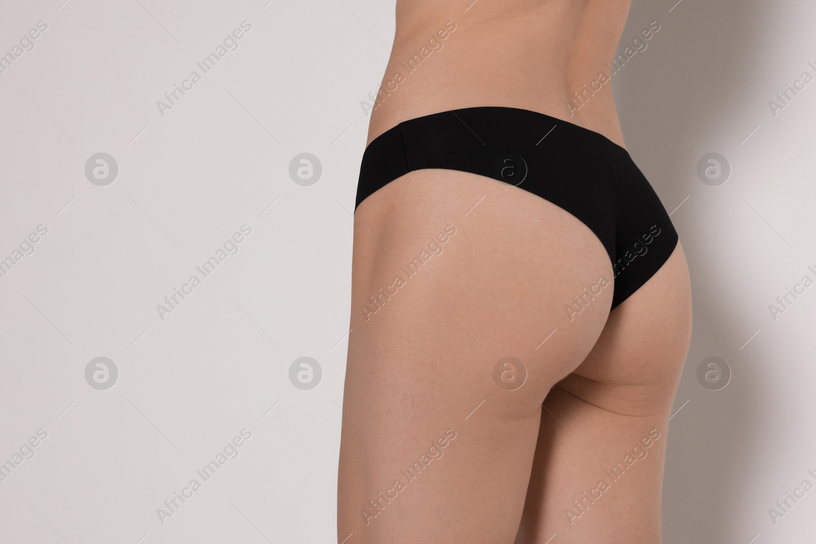 Photo of Woman with slim body on white background, closeup. Space for text