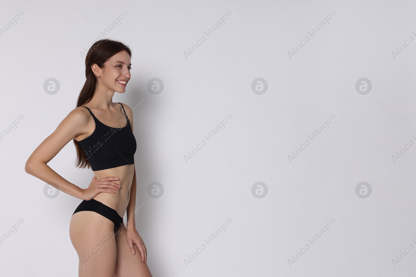 Photo of Woman with slim body on white background, space for text