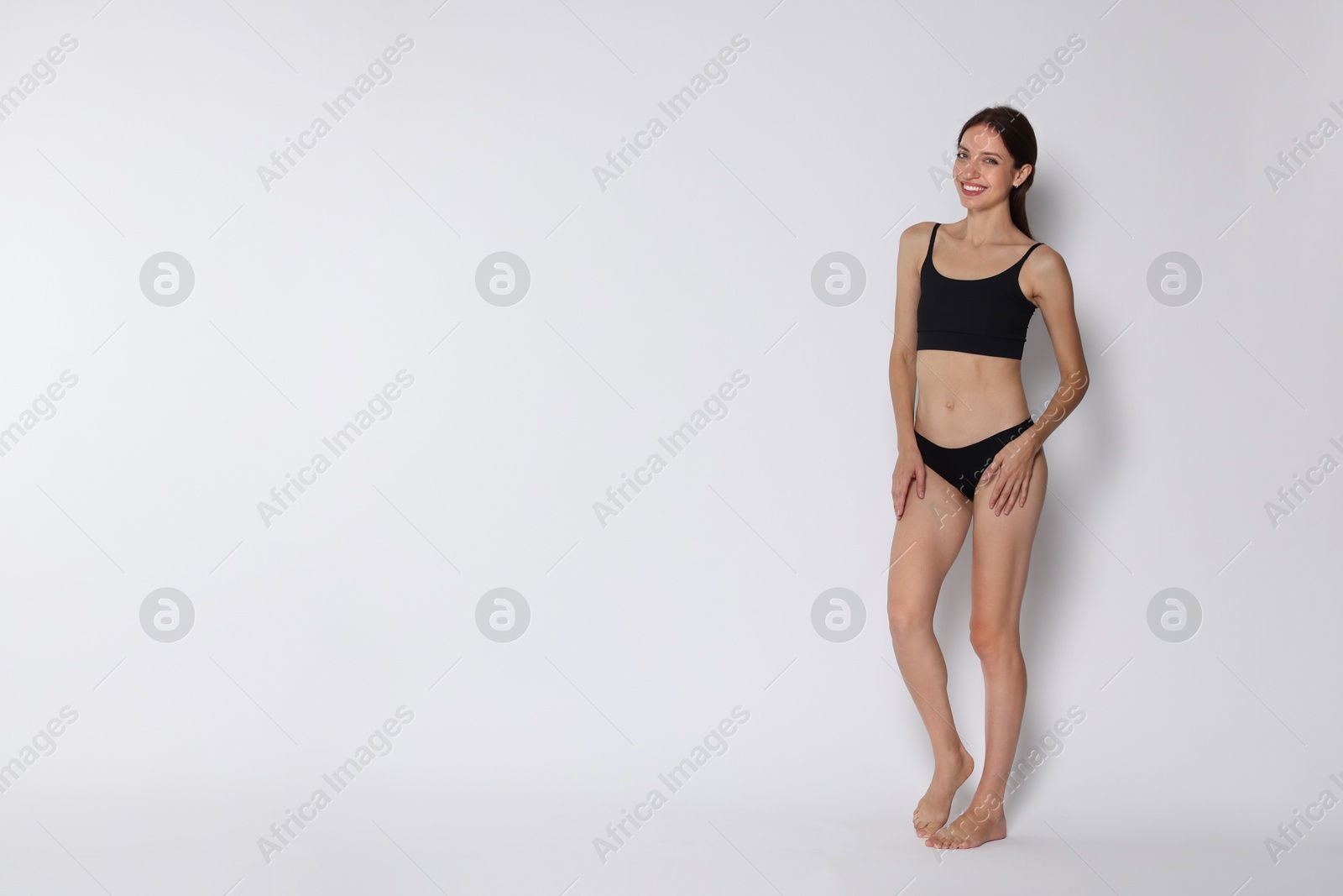 Photo of Woman with slim body on white background, space for text