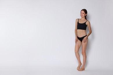 Photo of Woman with slim body on white background, space for text
