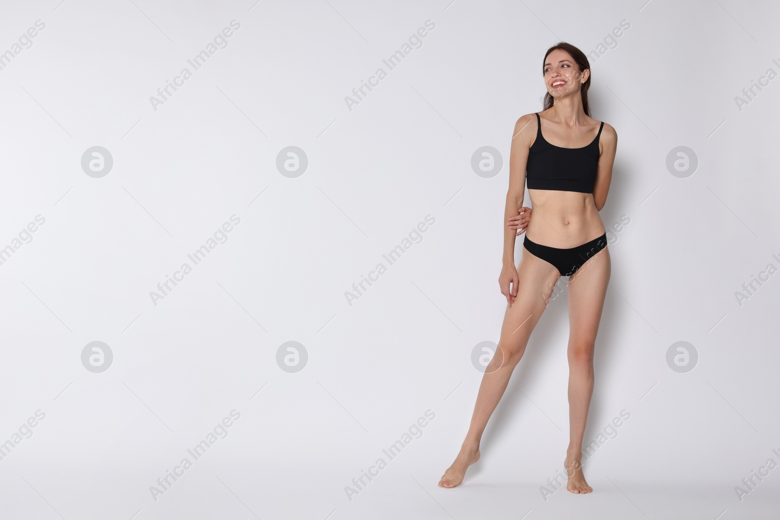 Photo of Woman with slim body on white background, space for text