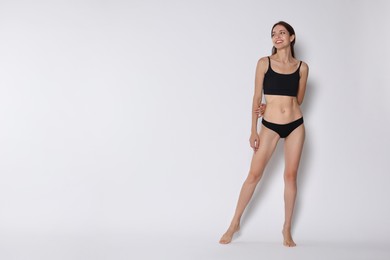 Photo of Woman with slim body on white background, space for text