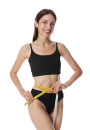 Photo of Woman with slim body measuring waist circumference on white background