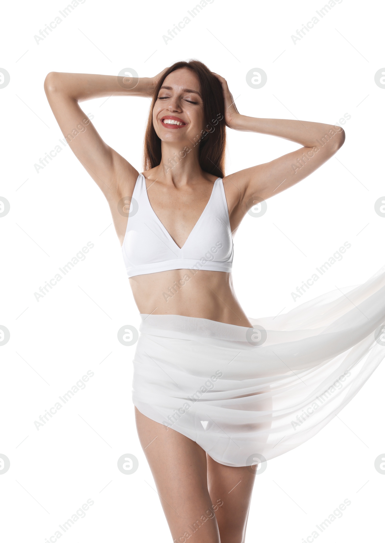 Photo of Woman covering her slim body with silk fabric on white background