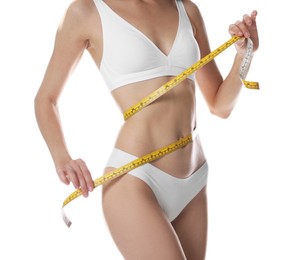 Photo of Woman with slim body and measuring tape on white background, closeup