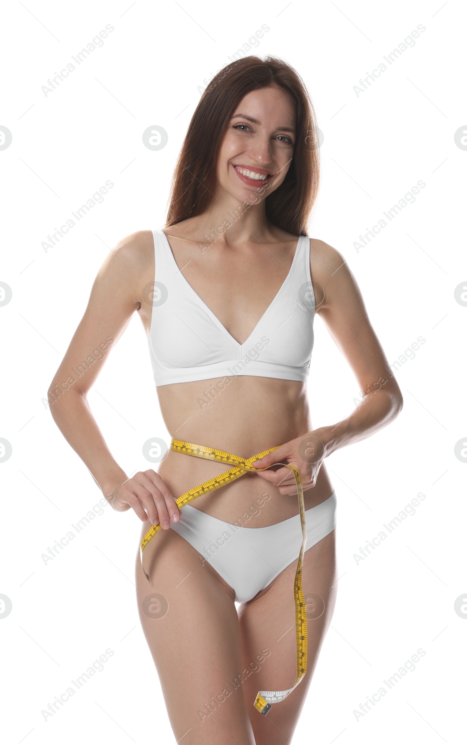Photo of Woman with slim body measuring waist circumference on white background