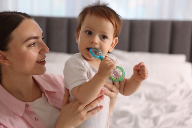 Photo of Mother and baby with cream on his face at home