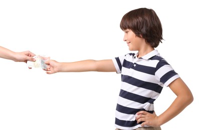 Photo of Mom giving her son pocket money on white background, closeup